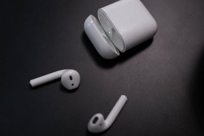 A Close-Up Shot of a White Wireless Earphones