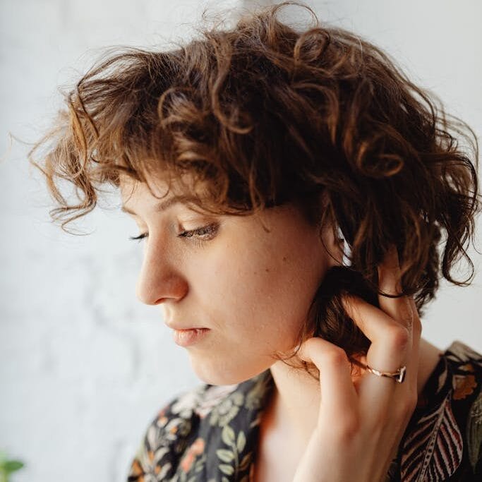 A Woman Wearing an Earphone